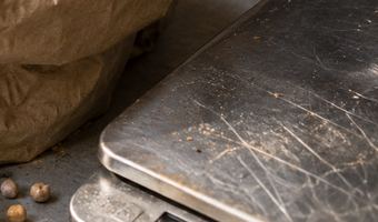 Corner of our ingredients flat-lay showing a kitchen scale — concept image